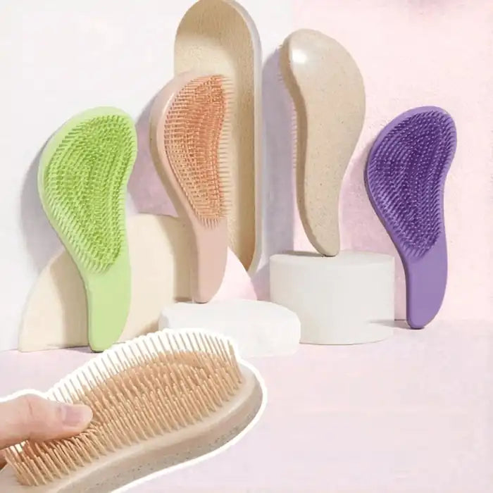 The EcoGlide brush held in the hand